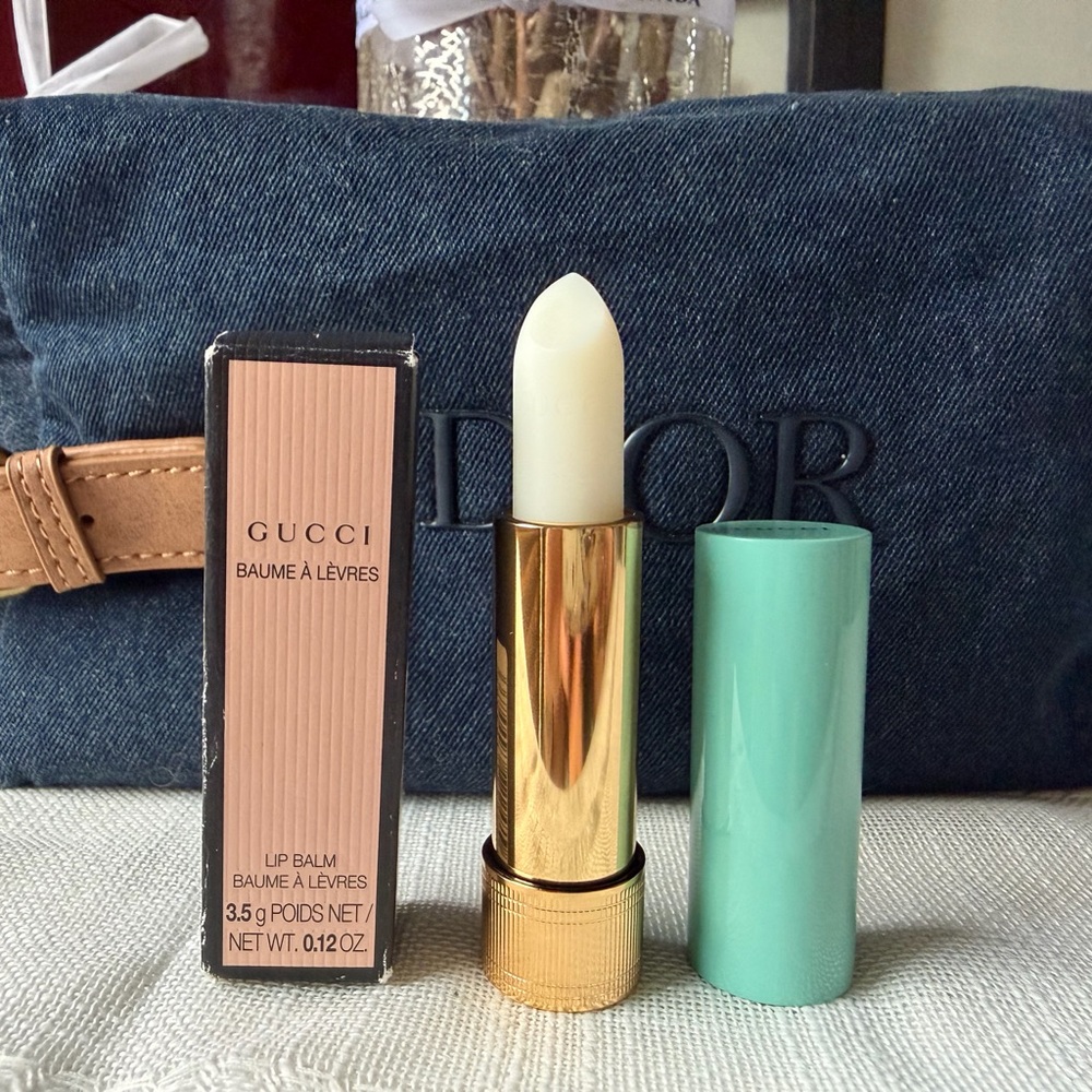 Gucci Lip Balm in Joslyn Clair with Gold and Mint Green cap.